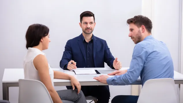 Mediator conducting negotiation session with couple