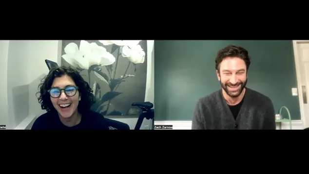 Two people smiling during virtual video call meeting