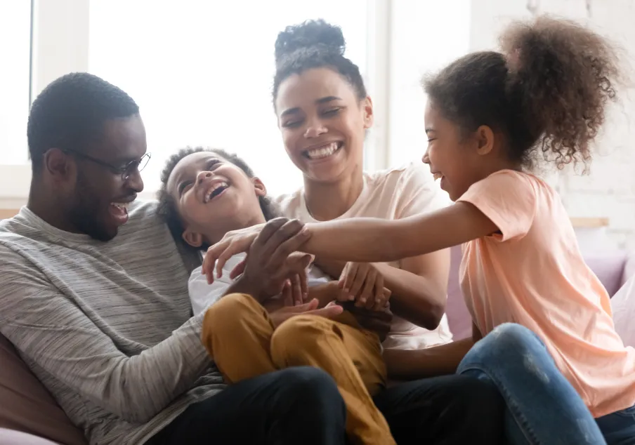 Parents with boy and girl laughing