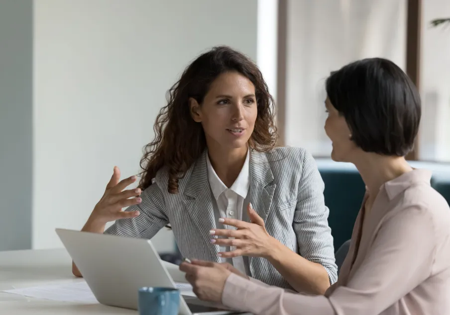 Two professional women talking