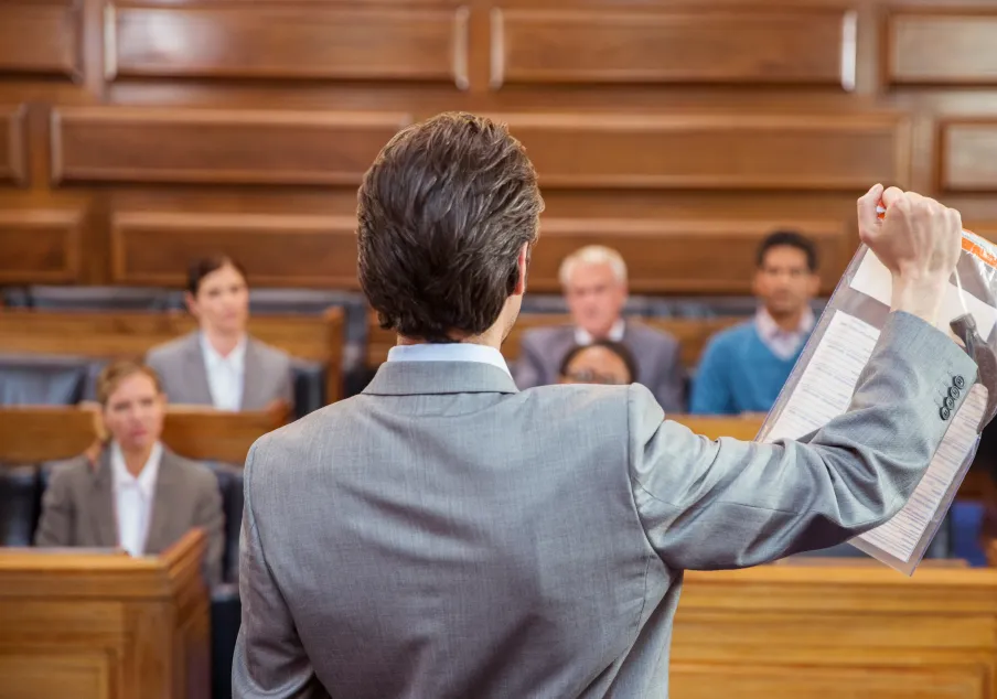 Lawyer showing evidence to jury in courtroom setting