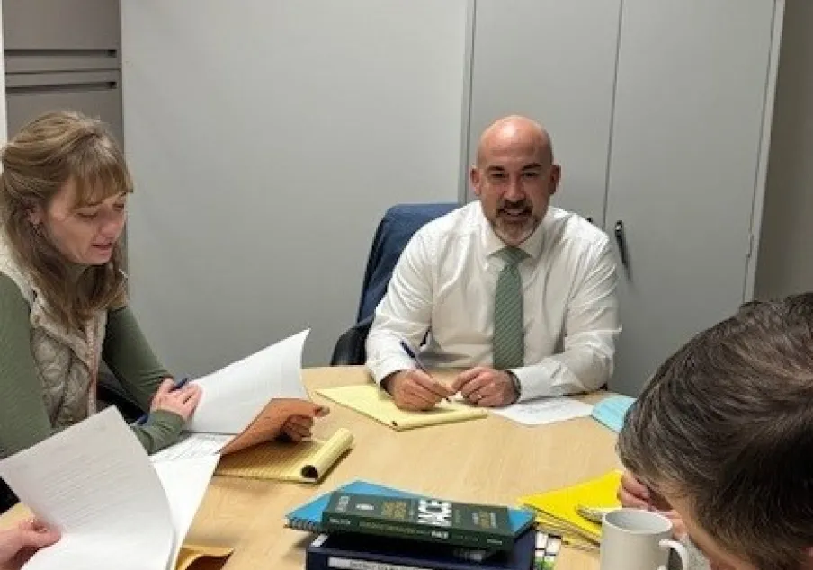 Photo of Bryan Farrell conducting a meeting