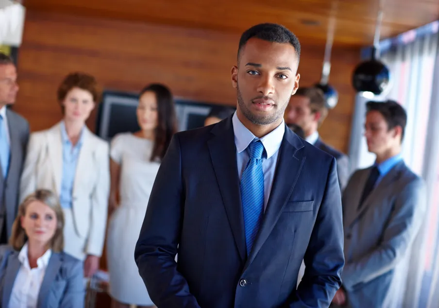 Diverse business team in office with confident leader