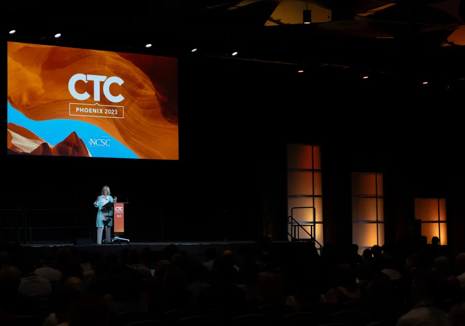 Speaker at podium presenting at CTC Phoenix 2023 conference