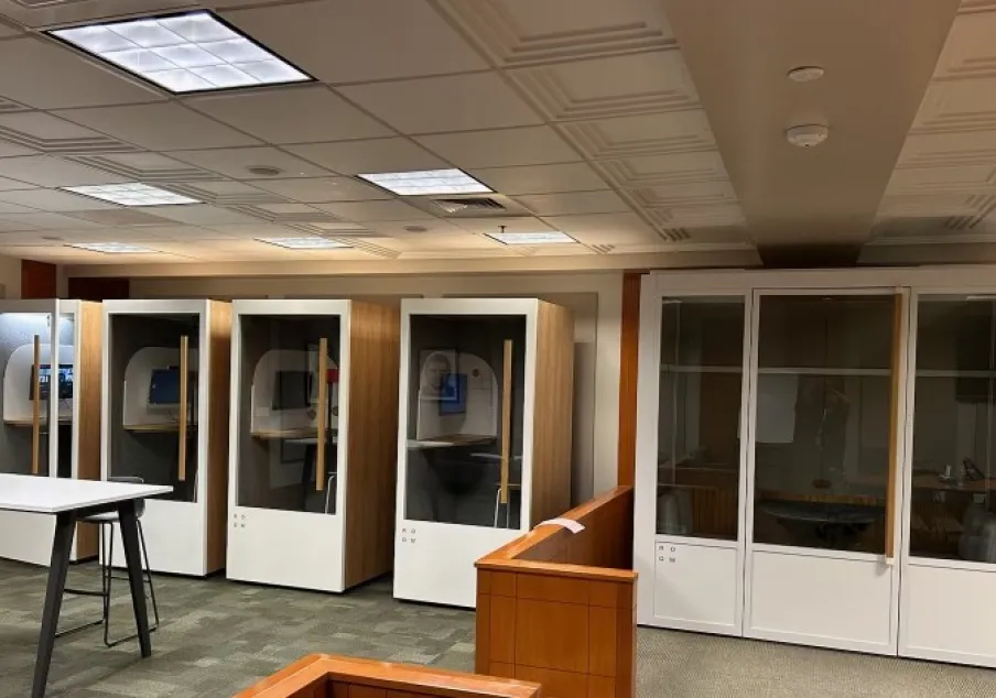 Private meeting booths in a court facility room.