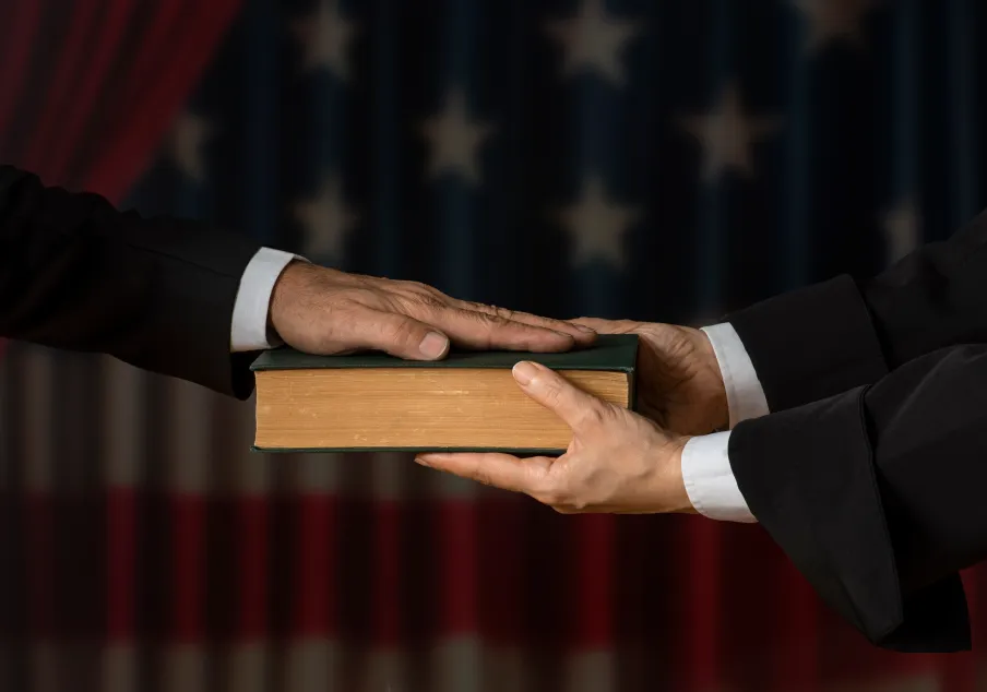 Placing a hand on the Bible and taking an oath