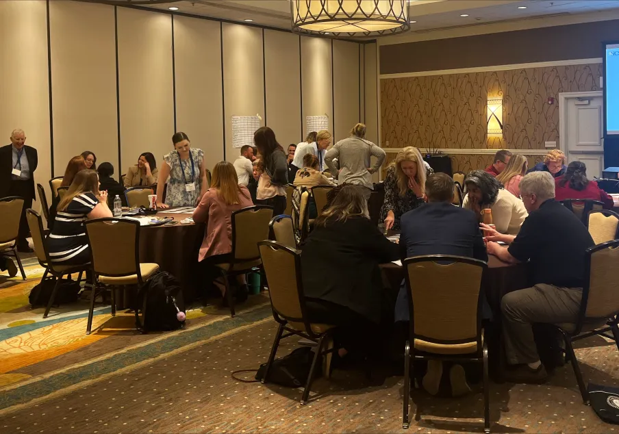 Group of people collaborating in a conference room session