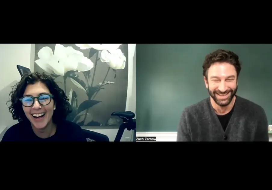 Two people smiling during virtual video call meeting