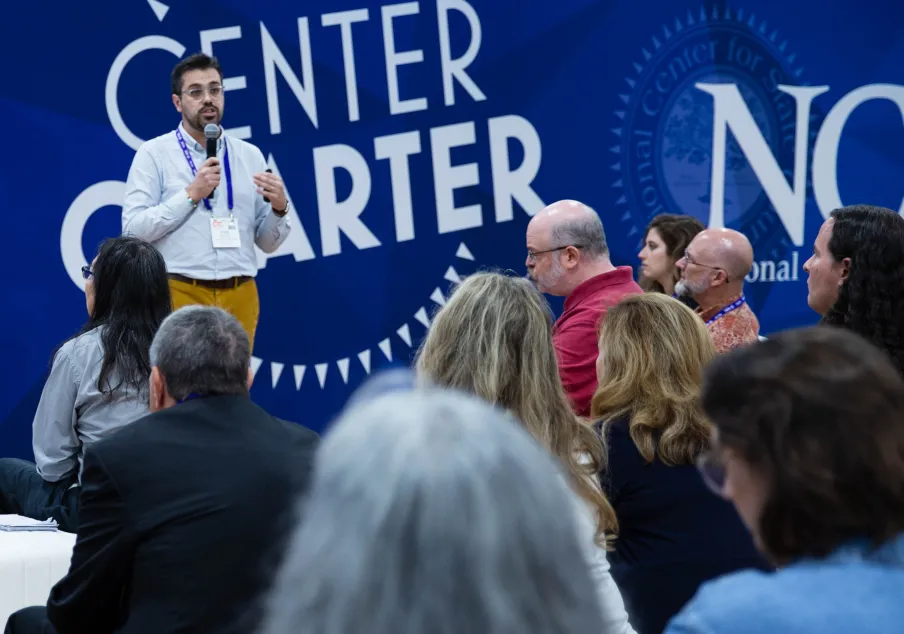 Presenter speaking to seated audience at NCSC event.