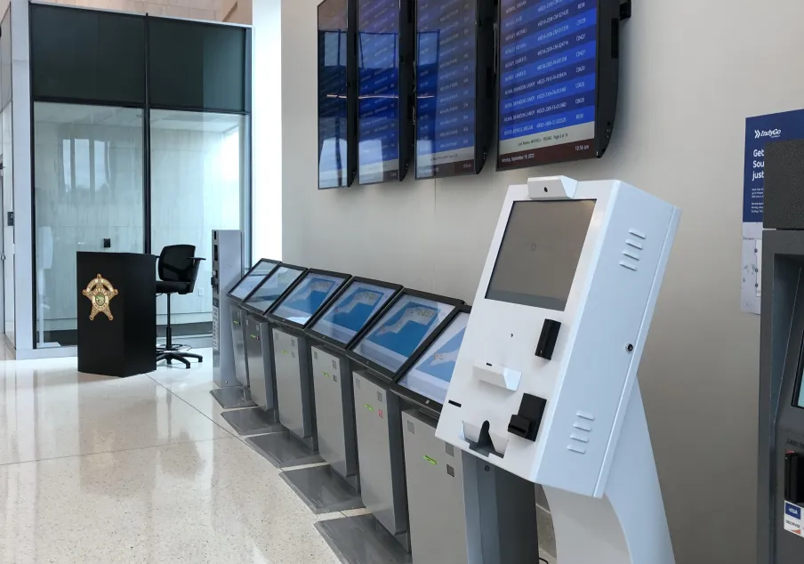 Interior of the Marion County courthouse in Indiania with a row of information kiosks.