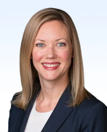 Professional headshot of smiling woman with blonde hair