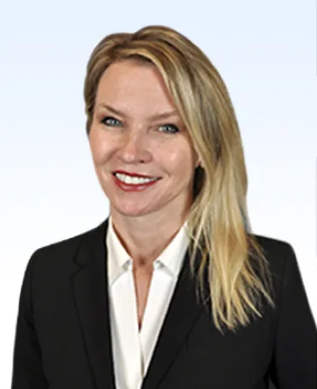 Professional headshot of woman in suit