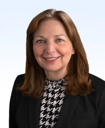 Professional headshot of a smiling woman.