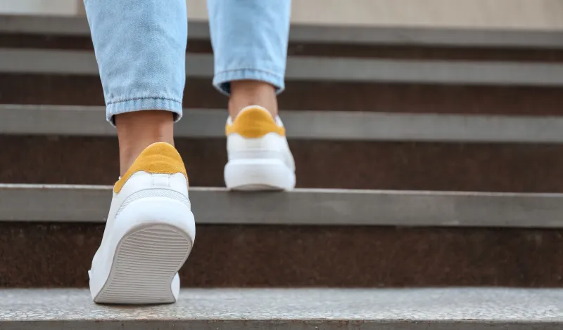 Person walking up stairs