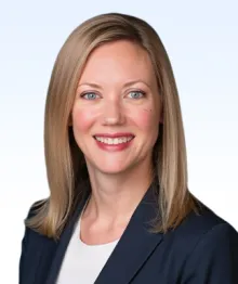 Professional headshot of smiling woman with blonde hair